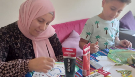 Mother and child during crafts activity